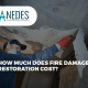 A worker in protective gear removing damaged materials from a ceiling after a fire, featuring the NEDES logo and the title "How much does fire damage restoration cost?"
