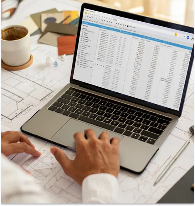 a closeup of laptop on which an expert is doing construction estimating services in Baltimore